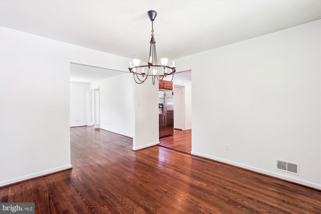 2445 Parallel Ln, Silver Spring, MD 20904 - spare room featuring a chandelier, dark wood-type flooring, and baseboards