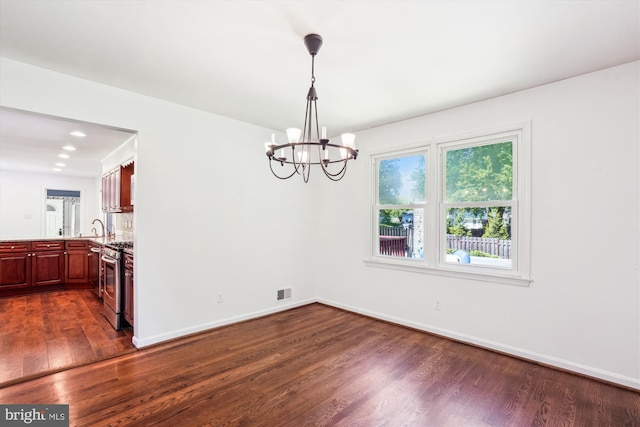 2445 Parallel Ln, Silver Spring, MD 20904 - unfurnished dining area featuring dark wood-style flooring, a chandelier, a sink, and baseboards
