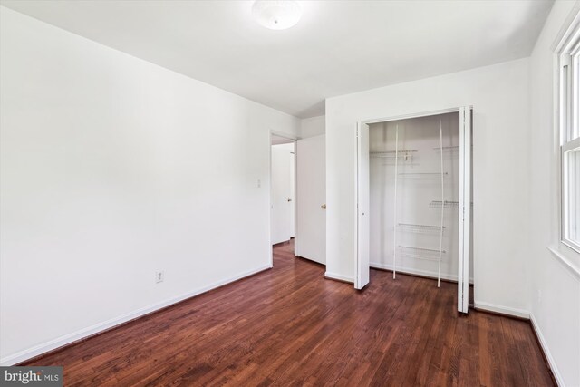 2445 Parallel Ln, Silver Spring, MD 20904 - unfurnished bedroom with dark wood-style floors, baseboards, and a closet