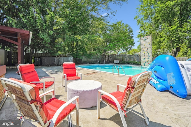 2445 Parallel Ln, Silver Spring, MD 20904 - view of swimming pool with a patio, a fenced backyard, and an outdoor fire pit
