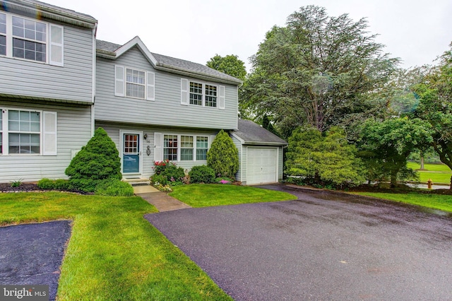 56 Zachary Dr, Chalfont, PA 18914 - colonial house with asphalt driveway, entry steps, a front yard, and a garage