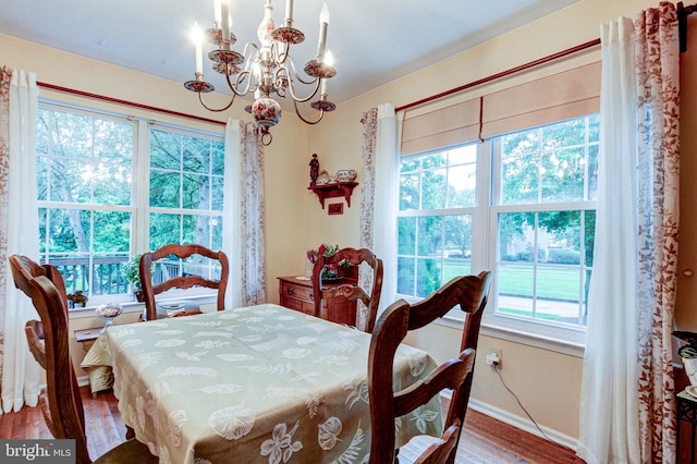 56 Zachary Dr, Chalfont, PA 18914 - dining room with a chandelier, wood finished floors, and baseboards