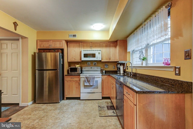 56 Zachary Dr, Chalfont, PA 18914 - kitchen with white appliances, a sink, dark stone counters, light flooring, and brown cabinetry