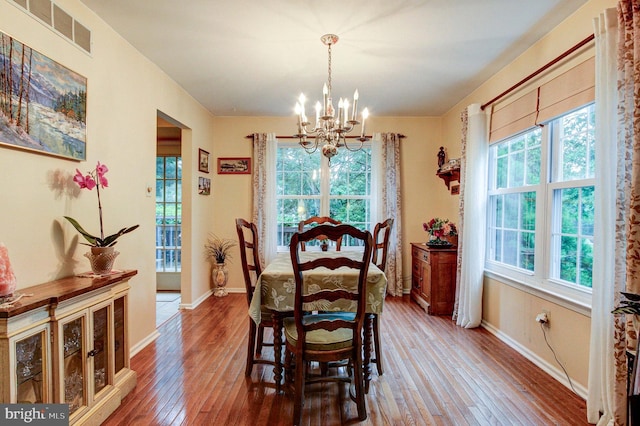 56 Zachary Dr, Chalfont, PA 18914 - dining area with a chandelier, hardwood / wood-style floors, and baseboards