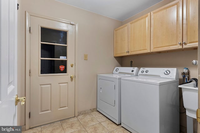 1908 Sterigere St, Eagleville, PA 19403 - laundry room featuring washer and dryer, cabinet space, light tile patterned flooring, and baseboards