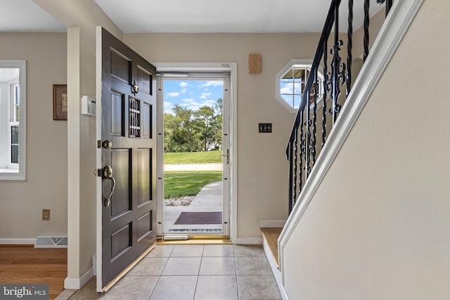 1908 Sterigere St, Eagleville, PA 19403 - entryway with stairway, baseboards, and light tile patterned flooring