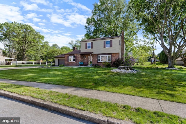 1908 Sterigere St, Eagleville, PA 19403 - view of front of home featuring a chimney, brick siding, and an attached garage