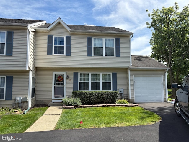 113 Megan Cir, Chalfont, PA 18914 - view of front of home featuring a garage, a front lawn, and asphalt driveway
