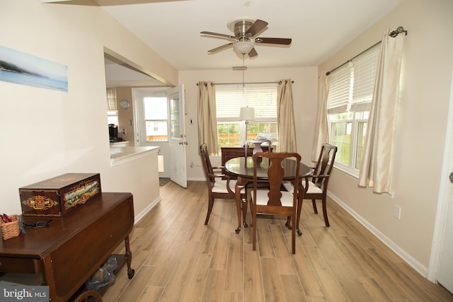 113 Megan Cir, Chalfont, PA 18914 - dining area with light wood finished floors, ceiling fan, and baseboards