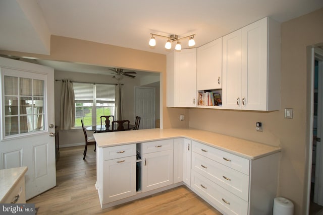 113 Megan Cir, Chalfont, PA 18914 - kitchen with light countertops, a peninsula, white cabinets, and ceiling fan