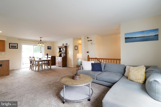 218 Independence Ave, State College, PA 16801 - living room with a chandelier and light colored carpet