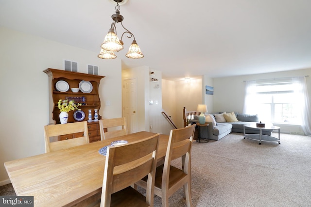 218 Independence Ave, State College, PA 16801 - carpeted dining space featuring a chandelier