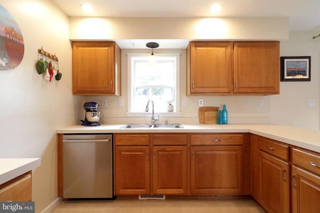 218 Independence Ave, State College, PA 16801 - kitchen featuring stainless steel dishwasher, a sink, brown cabinets, light countertops, and recessed lighting