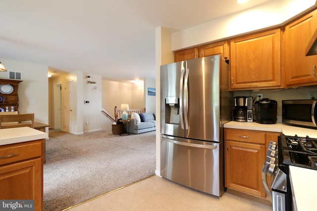 218 Independence Ave, State College, PA 16801 - kitchen with appliances with stainless steel finishes, light carpet, light countertops, and open floor plan