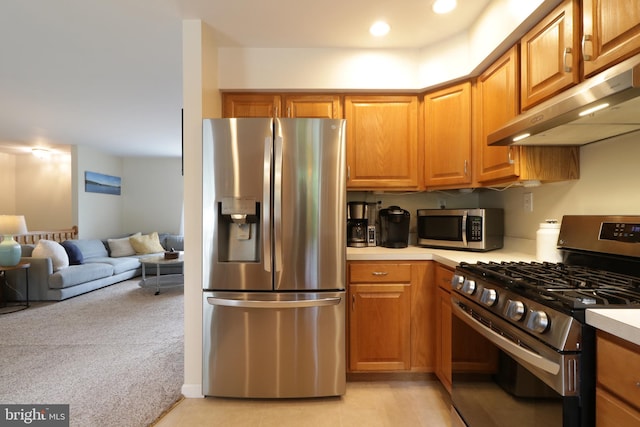 218 Independence Ave, State College, PA 16801 - kitchen with stainless steel appliances, under cabinet range hood, light countertops, light colored carpet, and open floor plan