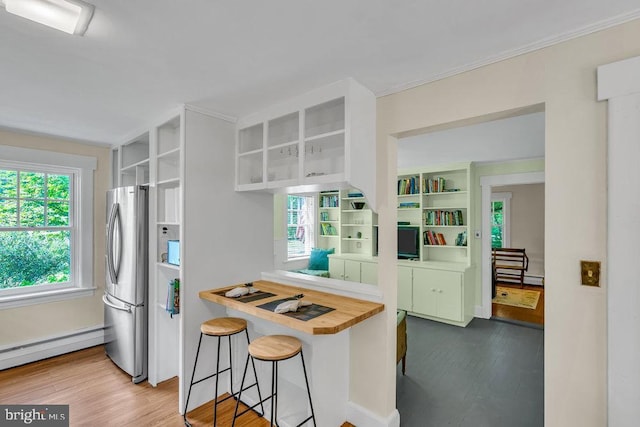 484 Rte 518, Skillman, NJ 08558 - kitchen with freestanding refrigerator, open shelves, wood counters, baseboard heating, and ornamental molding