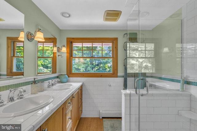 484 Rte 518, Skillman, NJ 08558 - full bath featuring tile walls, baseboard heating, double vanity, a shower stall, and a wainscoted wall