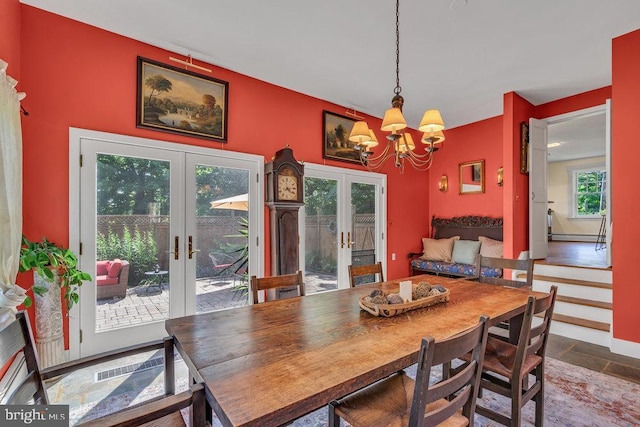 484 Rte 518, Skillman, NJ 08558 - dining area featuring french doors, a chandelier, and stone finish floors
