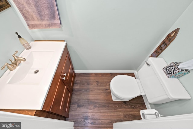 84 Winding Way, Upper Chichester, PA 19061 - half bathroom featuring toilet, wood finished floors, vanity, and baseboards