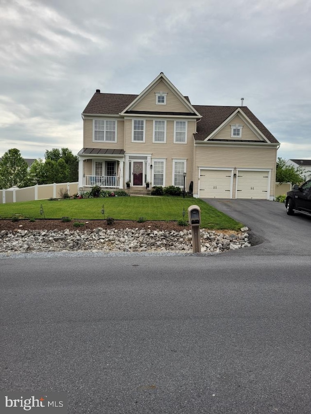 92 Inspiration Dr, Kearneysville, WV 25430 - traditional-style house featuring asphalt driveway, a porch, and a garage