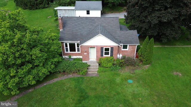 4599 Carlisle Rd, Gardners, PA 17324 - view of front of property with a front yard, brick siding, and a chimney
