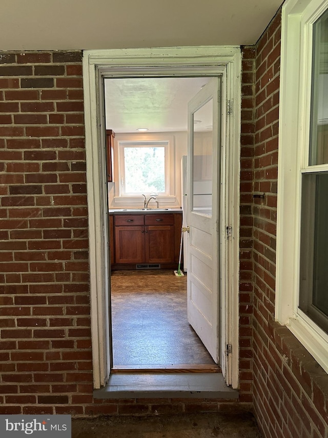 4599 Carlisle Rd, Gardners, PA 17324 - corridor featuring brick wall and a sink