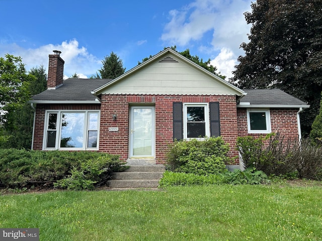 4599 Carlisle Rd, Gardners, PA 17324 - view of front of home with a chimney, a front lawn, and brick siding