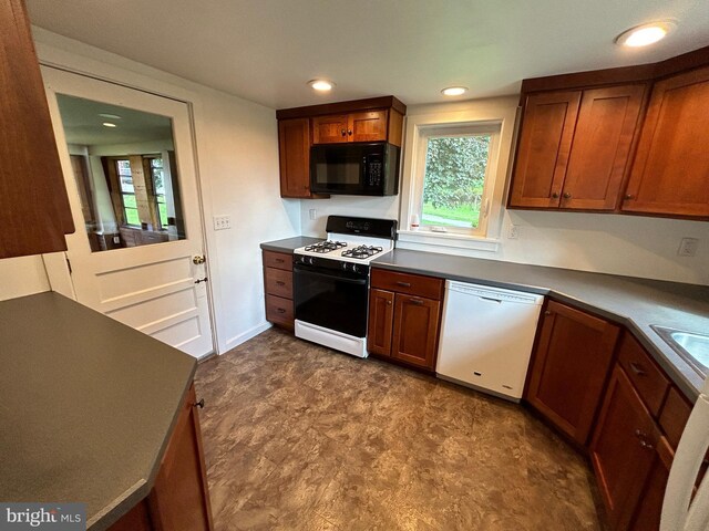 4599 Carlisle Rd, Gardners, PA 17324 - kitchen featuring range with gas cooktop, dishwasher, black microwave, dark countertops, and recessed lighting