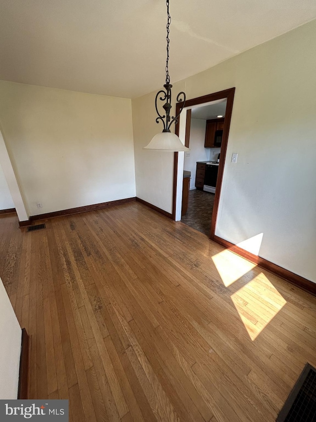 4599 Carlisle Rd, Gardners, PA 17324 - unfurnished dining area with dark wood finished floors and baseboards