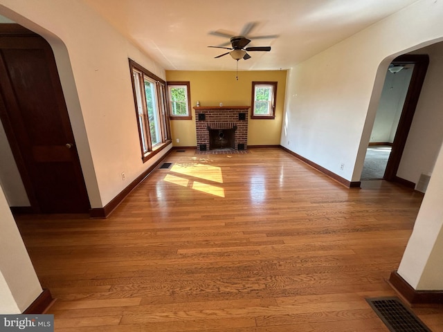 4599 Carlisle Rd, Gardners, PA 17324 - unfurnished living room with arched walkways, ceiling fan, and hardwood / wood-style floors