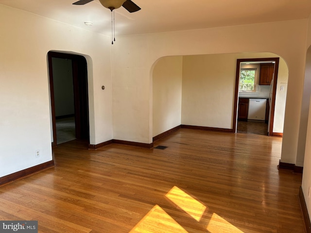 4599 Carlisle Rd, Gardners, PA 17324 - empty room with arched walkways, ceiling fan, and wood finished floors