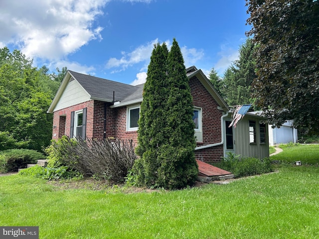 4599 Carlisle Rd, Gardners, PA 17324 - view of side of property featuring brick siding and a yard