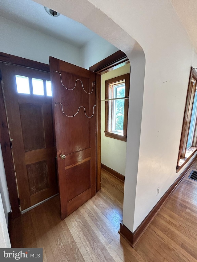 4599 Carlisle Rd, Gardners, PA 17324 - foyer entrance featuring light wood-type flooring, baseboards, and arched walkways