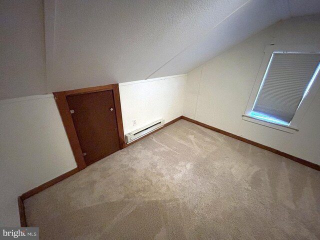 4599 Carlisle Rd, Gardners, PA 17324 - additional living space featuring lofted ceiling, baseboard heating, carpet flooring, a textured ceiling, and baseboards