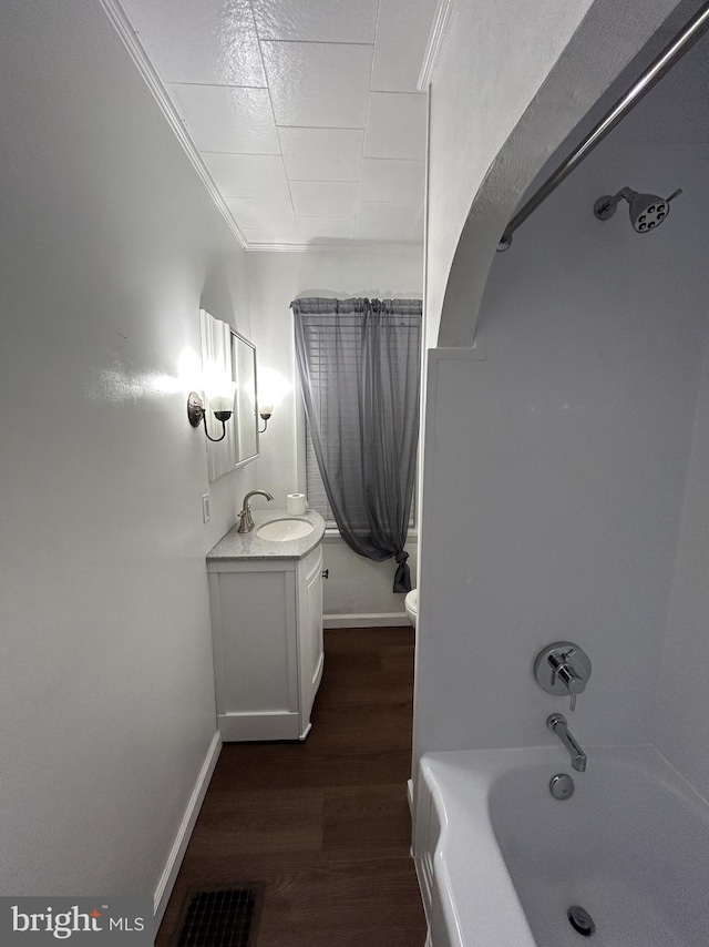 4599 Carlisle Rd, Gardners, PA 17324 - bathroom featuring vanity, wood finished floors, toilet, shower / bathtub combination, and ornamental molding