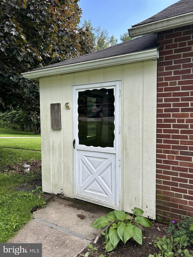 4599 Carlisle Rd, Gardners, PA 17324 - property entrance featuring brick siding and roof with shingles