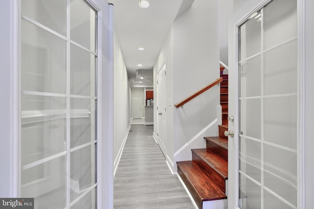 1129 Washington Blvd, Baltimore, MD 21230 - hallway featuring stairway, wood finished floors, recessed lighting, and baseboards