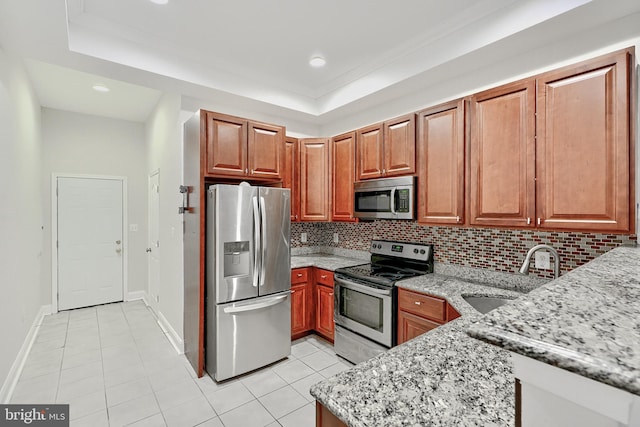1129 Washington Blvd, Baltimore, MD 21230 - kitchen with appliances with stainless steel finishes, a sink, light tile patterned floors, light stone countertops, and backsplash