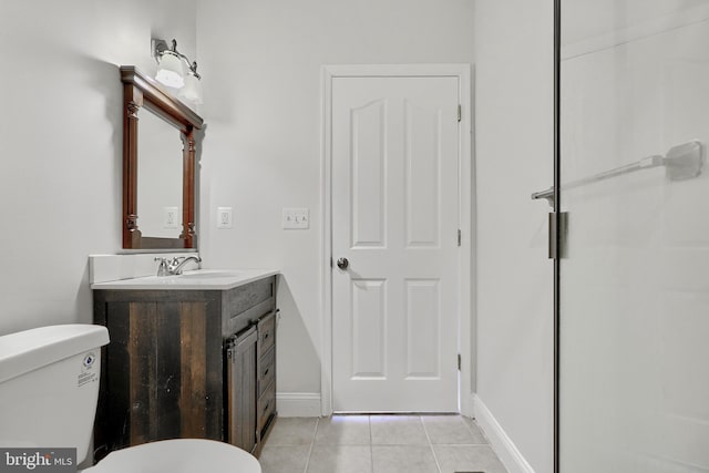 1129 Washington Blvd, Baltimore, MD 21230 - bathroom with tile patterned floors, toilet, vanity, and baseboards