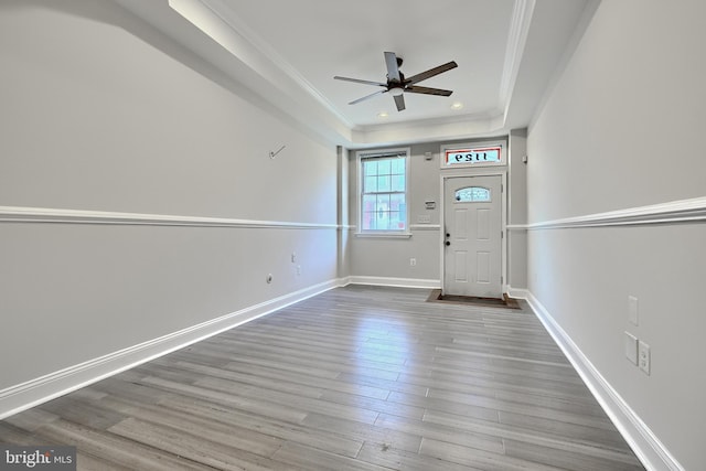 1129 Washington Blvd, Baltimore, MD 21230 - foyer entrance with ornamental molding, a tray ceiling, a ceiling fan, wood finished floors, and baseboards