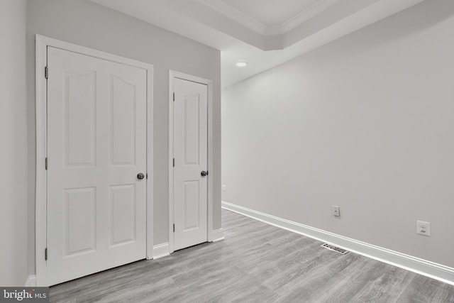 1129 Washington Blvd, Baltimore, MD 21230 - unfurnished bedroom with crown molding, light wood-style flooring, baseboards, and recessed lighting