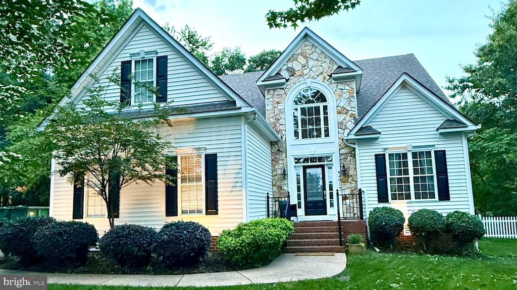 9401 Orchid Ter, Chesterfield, VA 23832 - traditional home featuring stone siding, a front lawn, and roof with shingles