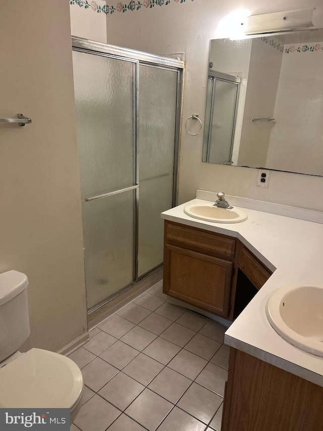 102 Stone Hurst Ct Unit 102, New Castle, DE 19720 - full bathroom featuring vanity, tile patterned floors, a stall shower, and toilet
