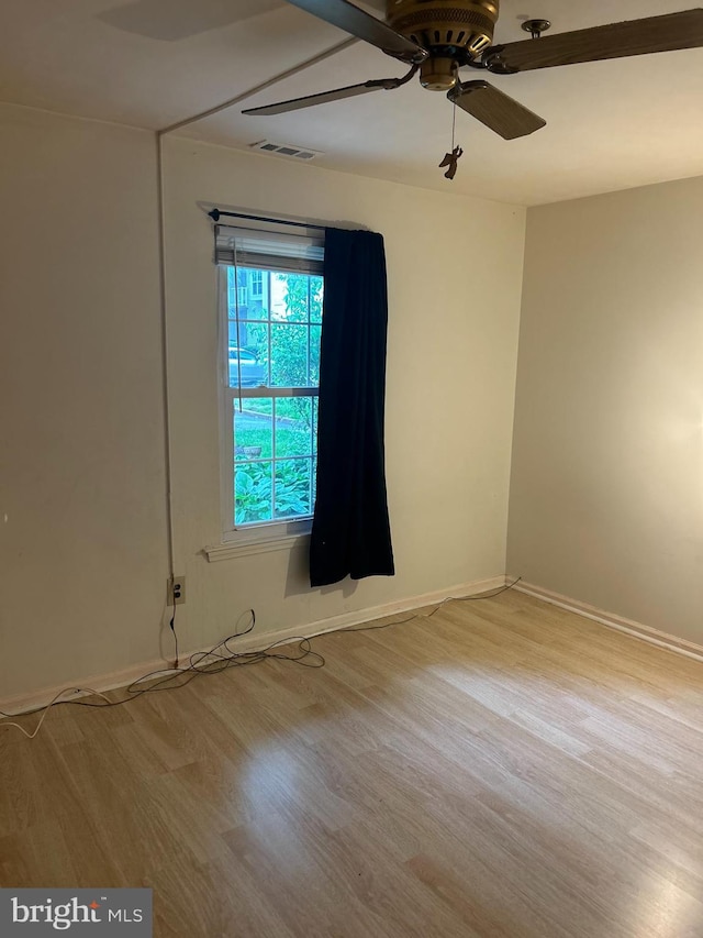 102 Stone Hurst Ct Unit 102, New Castle, DE 19720 - empty room with wood finished floors, a ceiling fan, and baseboards