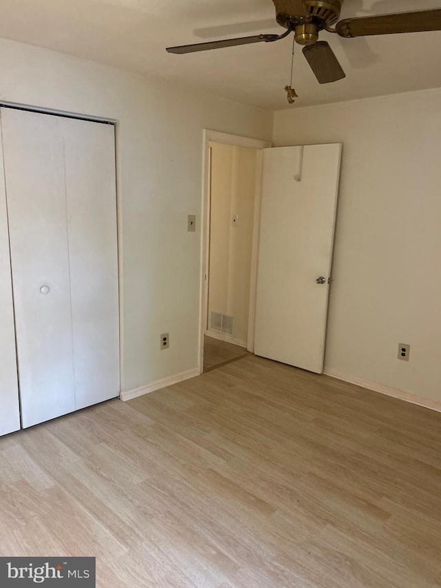 102 Stone Hurst Ct Unit 102, New Castle, DE 19720 - unfurnished bedroom with light wood-style floors, a closet, baseboards, and a ceiling fan