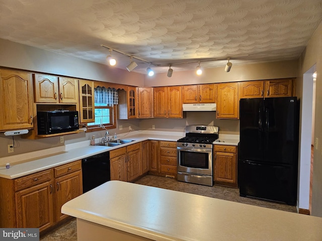 1511 Saint Francis Ln, Altoona, PA 16602 - kitchen with black appliances, under cabinet range hood, a sink, and brown cabinetry