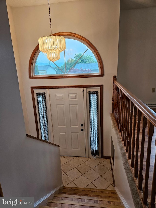 1511 Saint Francis Ln, Altoona, PA 16602 - foyer entrance featuring a chandelier, healthy amount of natural light, light wood-style floors, and stairway
