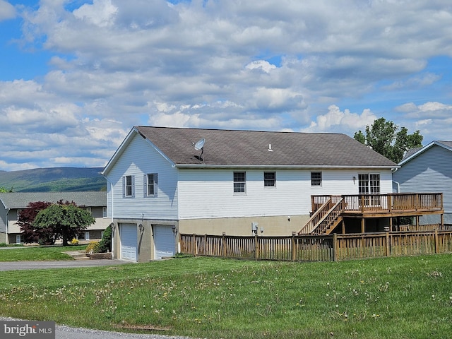 1511 Saint Francis Ln, Altoona, PA 16602 - back of house featuring stairs, a deck, a garage, driveway, and a shingled roof