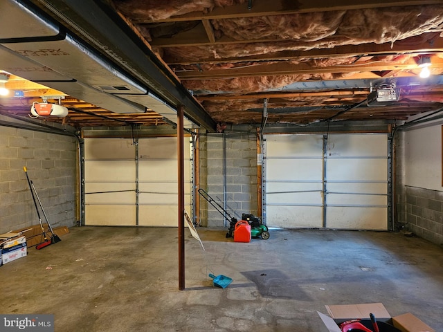 1511 Saint Francis Ln, Altoona, PA 16602 - garage featuring a garage door opener and concrete block wall