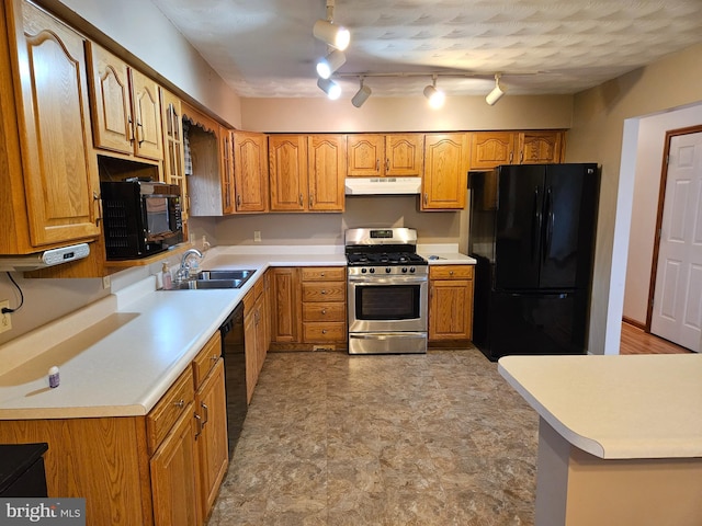 1511 Saint Francis Ln, Altoona, PA 16602 - kitchen with black appliances, under cabinet range hood, a sink, brown cabinets, and light countertops